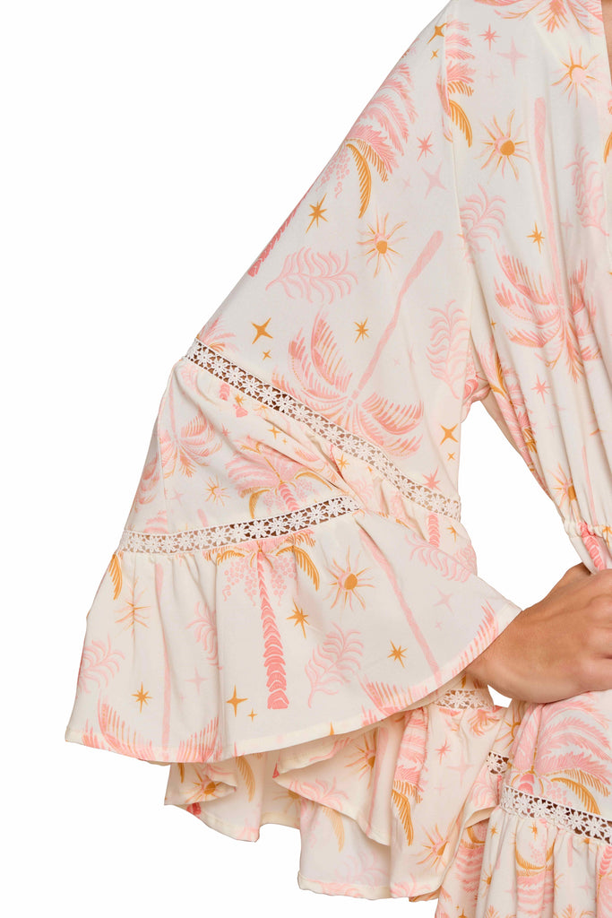 A close up look on the long hand ruffles of the Barbie Short Kimono, with star-shaped embroidery on the ruffles.